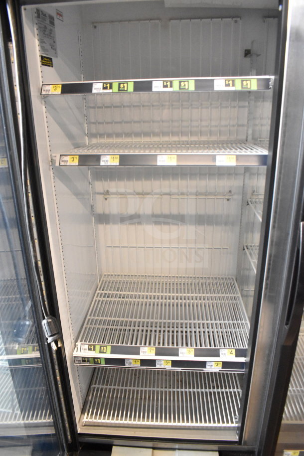 2017 True GDM-72F-HC commercial freezer merchandiser, 3 doors, tested and working, clean shelves, visible price tags.