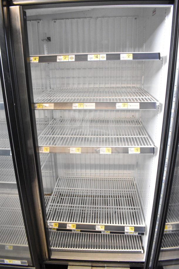 2017 True GDM-72F-HC commercial 3-door freezer merchandiser, tested and working, visible shelving, in clean condition.