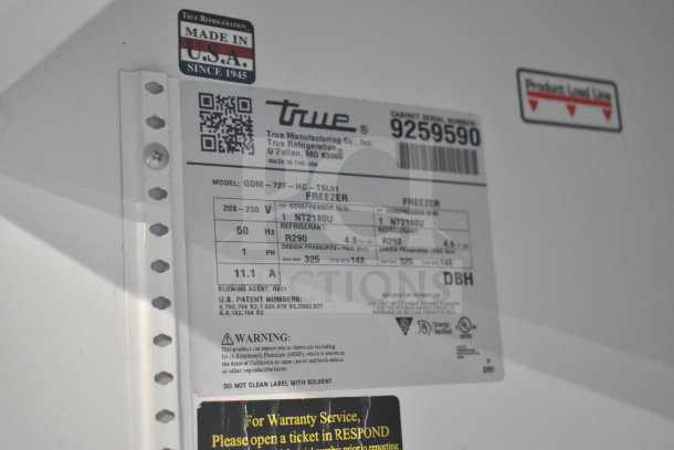 Label on the 2017 True GDM-72F-HC 3 Door Reach In Freezer showing model details, voltage, and refrigerant type. Made in USA.
