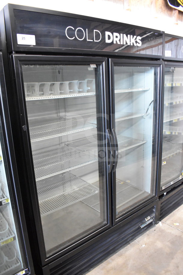 2017 True GDM-49-HC commercial cooler, 2 glass doors, black frame, shelves, labeled "Cold Drinks," working condition.