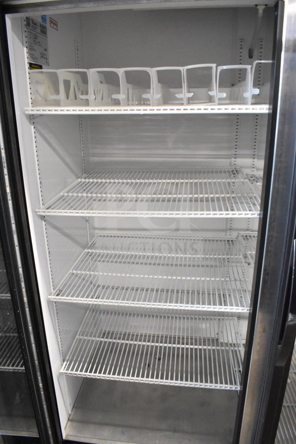 2017 True GDM-49-HC commercial reach-in cooler. Two glass doors, spacious shelves, 115 volts, one phase, tested working.