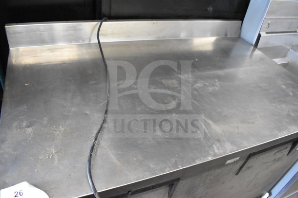 True TWT-48 commercial 2 door work top cooler in stainless steel. Features 115 volts, 1 phase, visible power cord.