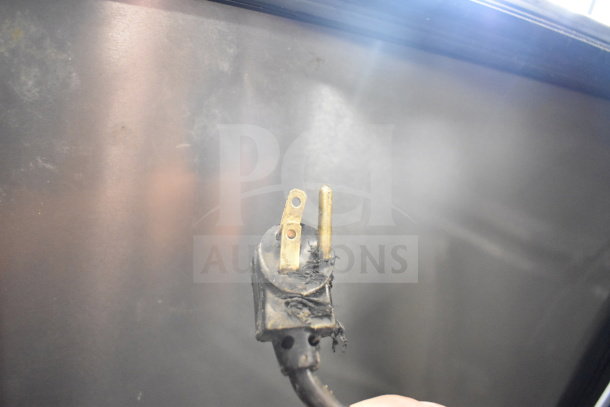 True TWT-48 Commercial Cooler, 2-door, 115 volts, showing damaged power plug, highlighting potential repair need.