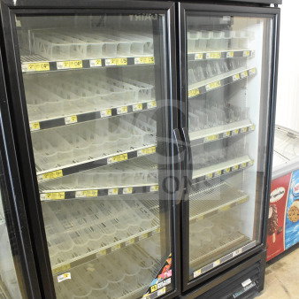 2017 True GDM-49-HC 3-door cooler merchandiser. Black exterior, glass doors, tested and working. 115 volts, 1 phase.