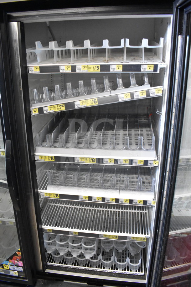 2017 True GDM-49-HC commercial 3-door reach-in cooler, tested and working, shelving visible, 115V, 1 phase.