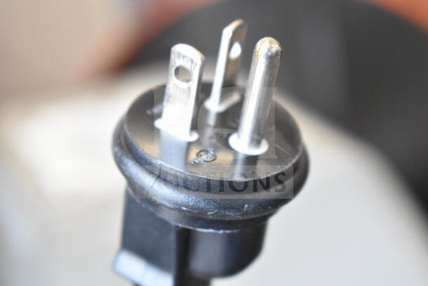 Close-up of a three-prong plug on the Globe SP30 commercial dough mixer, showing plug detail for 115 volts, 1 phase.