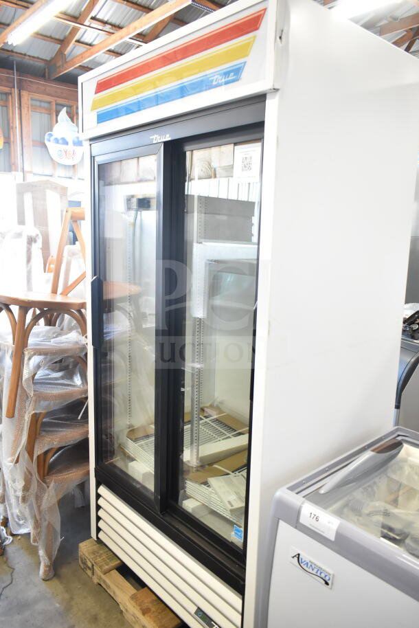 Brand new True GDM-33-HC-LD commercial 2-door reach-in cooler, scratch and dent, 115 volts, 1 phase, in warehouse setting.