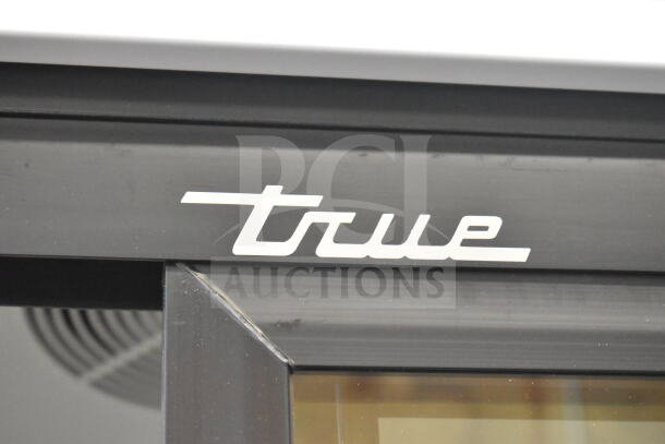 True logo on the GDM-33-HC-LD commercial cooler, highlighting brand quality and sleek design.