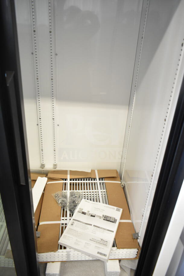 Brand new 2025 True GDM-33-HC-LD commercial 2-door cooler merchandiser. Includes manual, packaging materials inside. 115V, 1 phase.