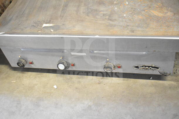 Star Commercial Electric Flat Top Griddle, countertop model, stainless steel, used condition, visible control knobs.
