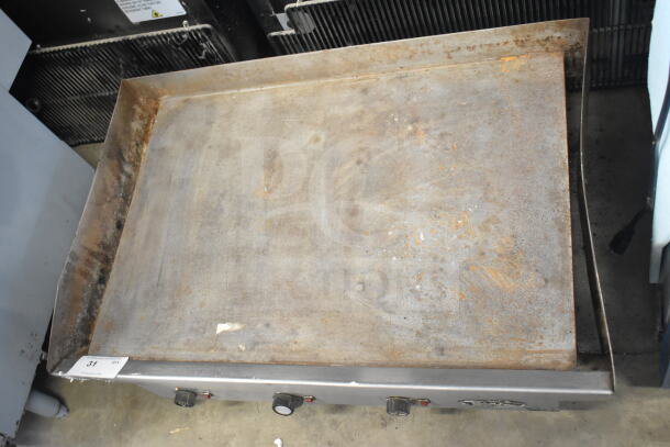 Star Commercial Electric Flat Top Griddle, countertop model, with visible wear and rust, control knobs, and power cord.