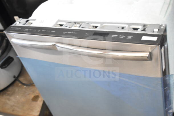 Frigidaire undercounter dishwasher with stainless steel finish, visible control panel, new condition, model label visible.
