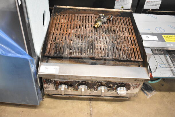 Vollrath Commercial Gas Charbroiler Grill, countertop model. Features rusted grates, four control knobs, fair condition. Auction tag visible.