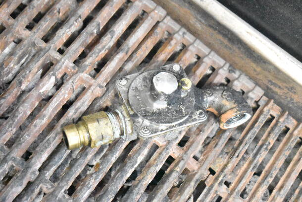 Vollrath Commercial Countertop Gas Charbroiler Grill with metal grates, showing gas connection. Used condition, some wear visible.