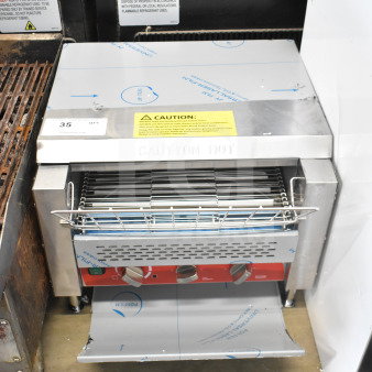 Brand new Avantco 184T3600B commercial conveyor toaster, 14.5" wide, 3" opening, 1200 slices/hour, labeled for caution.