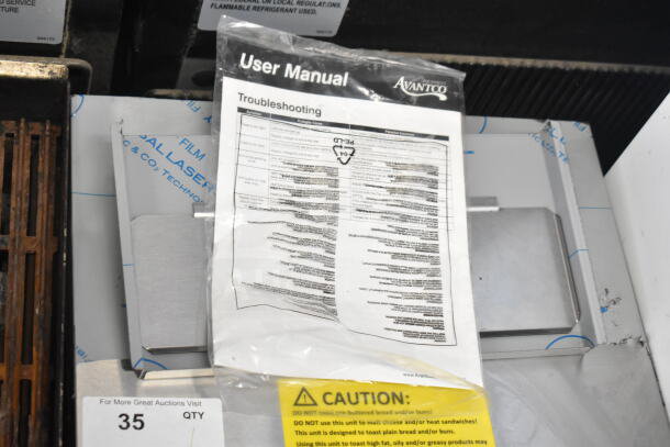 Brand new Avantco 184T3600B conveyor toaster, 14 1/2" wide, 3" opening, 1200 slices/hour. Includes user manual and caution label.
