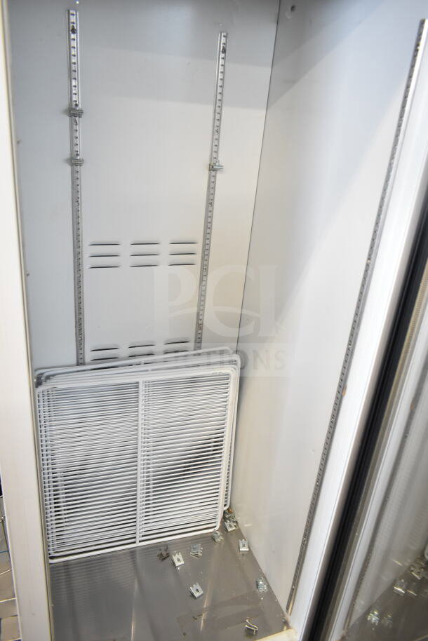 Habco SE18HC commercial cooler interior, single door, 115V, 1 phase; includes racks, adjustable shelving, clean condition.