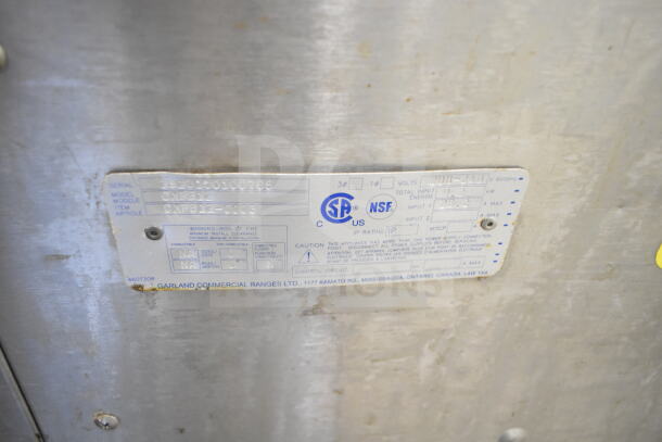 Garland CXPB12 commercial flat top grill label; 208-240V, 3 phase; model and serial numbers shown; NSF certified.