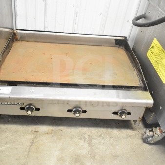 Radiance Commercial Countertop Flat Top Griddle with three control knobs. Used condition with visible surface wear.