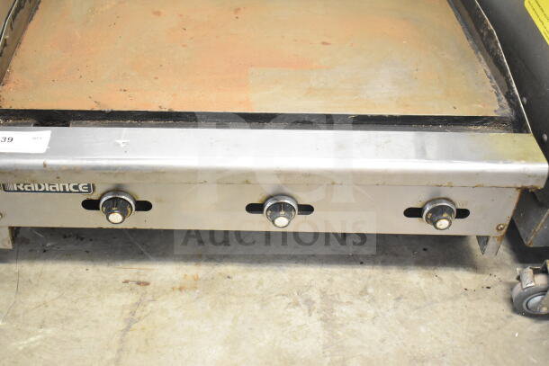 Radiance Commercial Countertop Flat Top Griddle with three control knobs, showing signs of use. Brand logo visible.