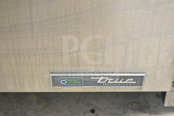 2023 True TUC-27-HC undercounter cooler with natural refrigerant label, on commercial casters, 115V, 1-phase.