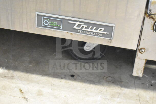 2023 True TUC-27-HC undercounter cooler on commercial casters, stainless steel, natural refrigerant label.