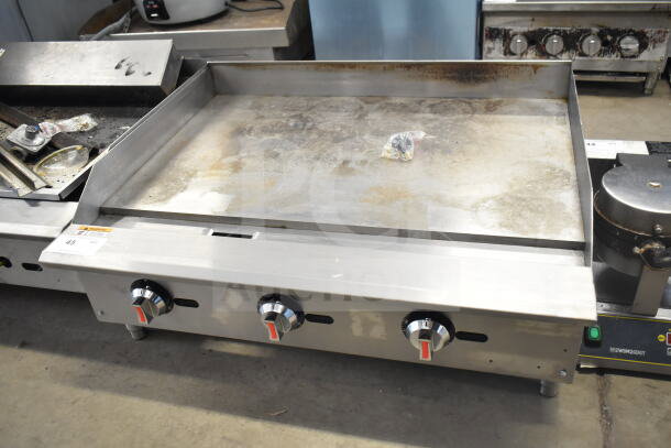 2025 Vesta C36TGG commercial countertop natural gas flat top griddle, 90,000 BTU, stainless steel, minor surface wear.