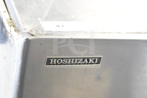 Hoshizaki KM-900MRH commercial ice machine head, stainless steel, visible wear, 208-230V, 1 Phase, brand label shown.