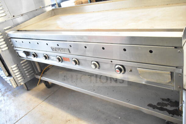 Vulcan commercial gas flat top griddle with undershelf, stainless steel, multiple burners, logo and control knobs visible.