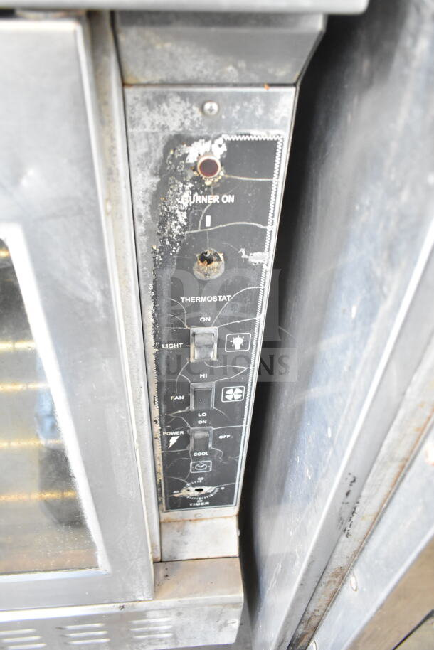 Royal commercial gas convection oven control panel, showing wear. Features timer, thermostat, fan and power controls.
