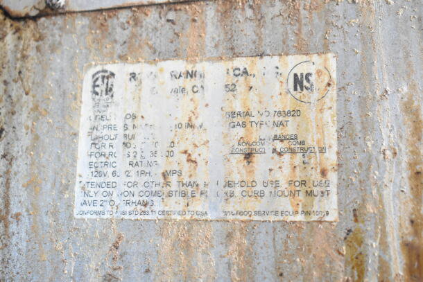 Rusty label on a Royal commercial oven, showing serial number 763820, natural gas type, electrical and construction details.