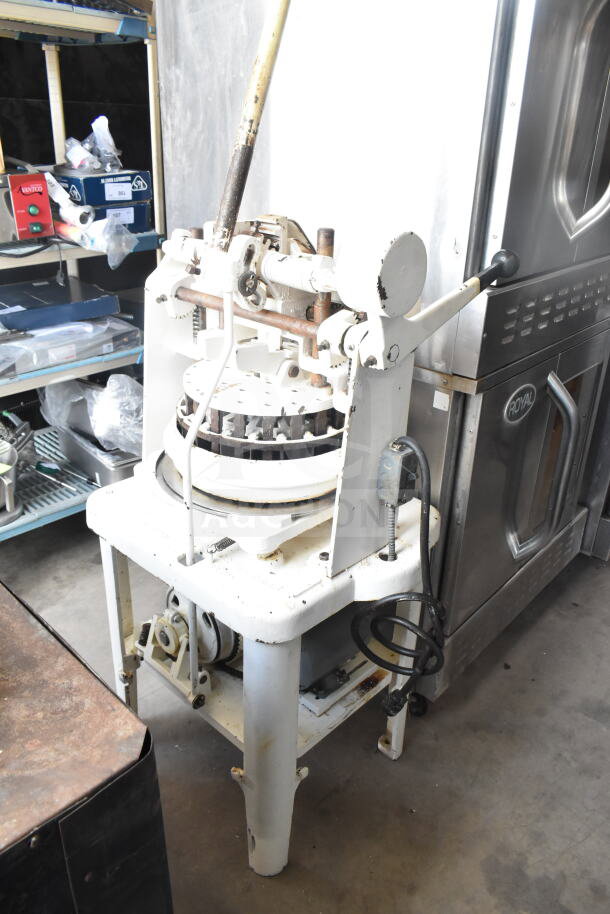 Dutchess Commercial Floor Style Dough Divider, white metal, used condition, visible wear, manual operation lever.