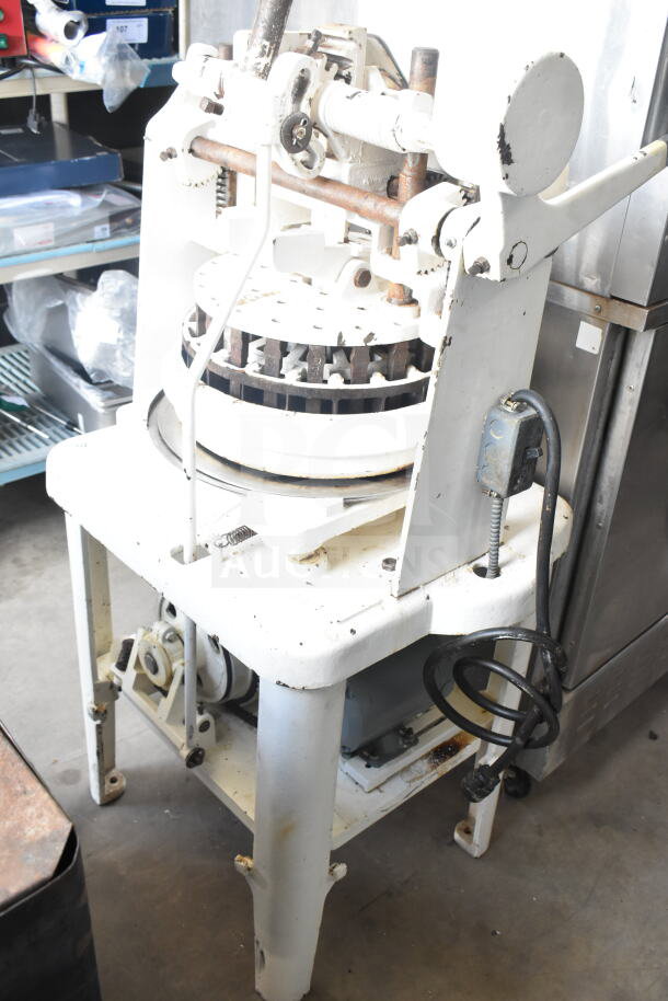 Dutchess Commercial Floor Style Dough Divider in fair condition, showing wear. Manual operation with visible levers and gears.