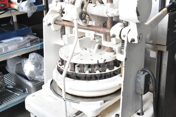 Dutchess Commercial Floor Style Dough Divider in used condition. Features mechanical components and visible wear.