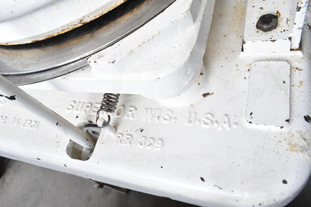 Dutchess Commercial Floor Style Dough Divider, showing embossed labeling, used condition with visible wear.