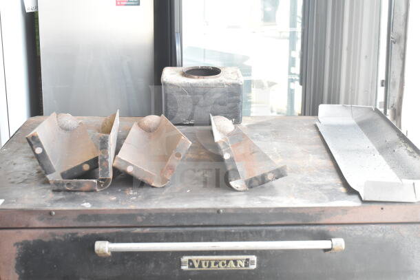 Vulcan commercial natural gas 2-deck pizza oven with metal legs, shows wear; Vulcan branding visible on front panel.