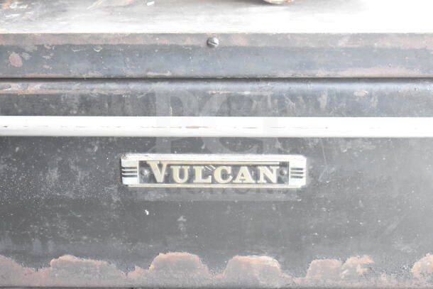 Vulcan 2-deck natural gas pizza oven with metal legs, showing brand plate. Used condition with visible wear on surface.