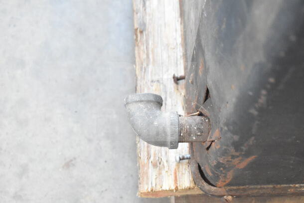 Vulcan commercial 2-deck pizza oven, natural gas powered, with metal legs, showing wear and rust on the corner and pipe.