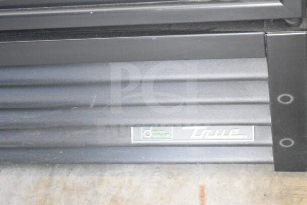 2020 True GDM-26-HC single door reach-in cooler, black exterior, features natural refrigerant label.