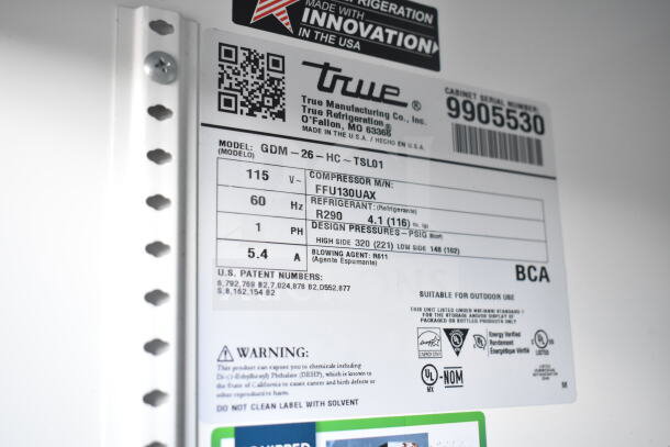 Label of 2020 True GDM-26-HC Cooler Merchandiser showing model details, voltage, refrigerant R290, and certifications.