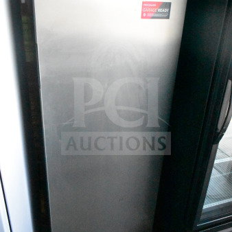 Frigidaire FGFRF1008 convertible cooler freezer, single door, 115 volts, 1 phase, garage ready label visible, silver finish.