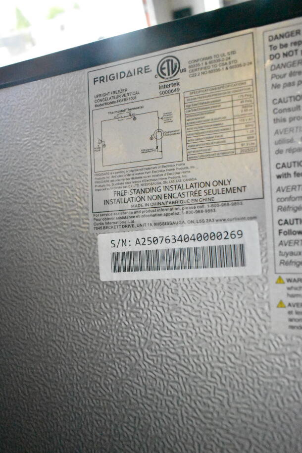 Frigidaire FGFRF1008 single door reach-in convertible cooler freezer, 115V, 1 phase. Label shows specs and serial number A2507634040000269.