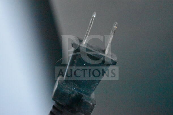 Close-up of a two-prong power plug for the Frigidaire FGFRF1008 cooler freezer, indicating 115 volts, 1 phase.