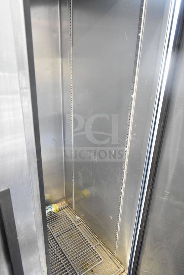 2017 True T-35 Commercial Cooler, 2-door, reach-in, 115 volts, 1 phase. Interior shelves, clean condition, minor wear.
