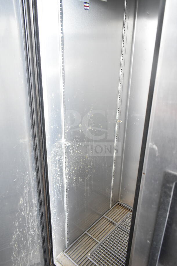 2017 True T-35 2 Door Reach-In Cooler, 115V, 1 Phase. Interior shelving shown, some visible wear. Model label present.