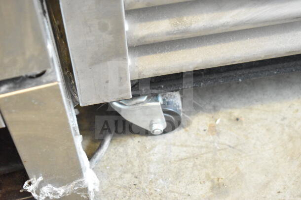 2021 True T-19F-HC freezer caster, showing stainless steel finish and commercial wheel.