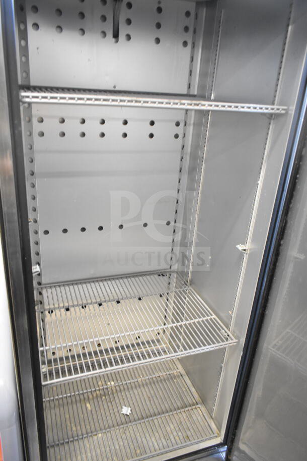 2018 True T-19F-HC Commercial Single Door Reach-In Freezer, three wire shelves, 115V, 1 Phase, well-maintained interior.