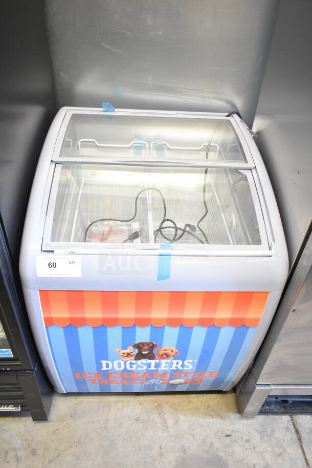 Dogsters XS-160Y Chest Freezer Merchandiser, 115 Volts, 1 Phase, good condition, promotional graphics on front.