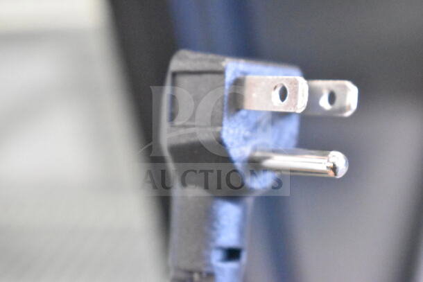 Close-up of an electrical plug for a Dogsters XS-160Y Chest Freezer Merchandiser, 115 volts, 1 phase.