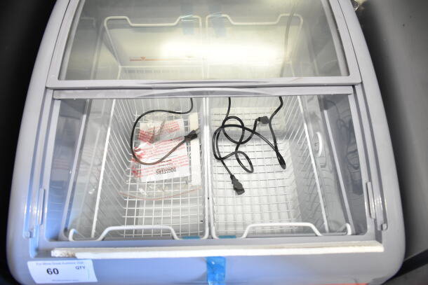 Dogsters XS-160Y chest freezer merchandiser, 115 volts, 1 phase, open top view with internal baskets, cords, and Dogsters label.